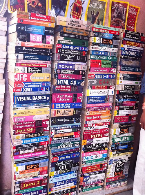 A large pile of programming books with many different languages